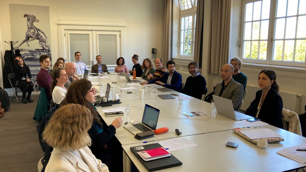 Kick-off meeting GoGreen with several GoGreen members around a big table at the Atelier building in Amsterdam