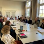 Kick-off meeting GoGreen with several GoGreen members around a big table at the Atelier building in Amsterdam