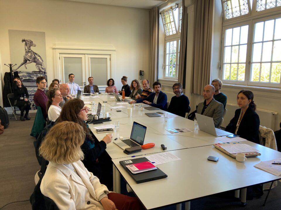 Kick-off meeting GoGreen with several GoGreen members around a big table at the Atelier building in Amsterdam