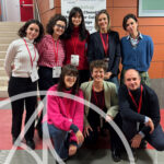 Researchers in front of Greener Cleaning Methods for Cultural Heritage workshop poster