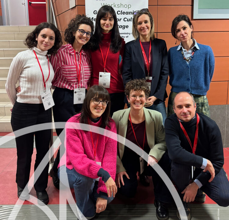 Researchers in front of Greener Cleaning Methods for Cultural Heritage workshop poster